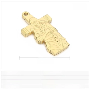 Macro detail of golden stainless steel cross pendant showing precise Jesus engraving