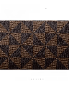 Detailed view of the brown geometric triangle pattern on durable leather bucket bag