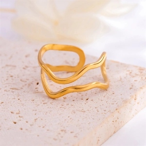 Minimalist double-layered gold wave open ring for women on natural stone display