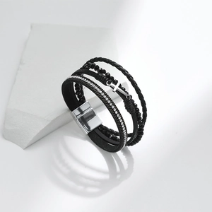 Close-up of black multilayer leather bracelet with crystal beads and silver cross pendant