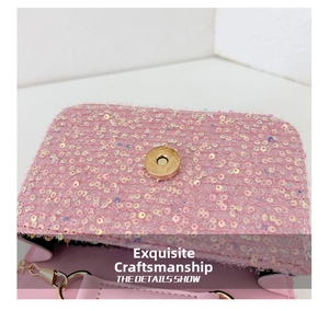 Close-up of pink sequin handbag showing gold magnetic buckle and fine inner lining