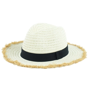White straw sun hat with black ribbon and frayed brim for outdoor beach travel