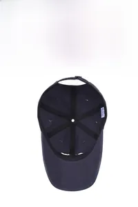 Detail of navy baseball cap interior showing breathable mesh, reinforcing tape and adjustable strap
