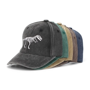 Close-up of kids washed cotton baseball caps with dinosaur skeleton embroidery in 5 colors