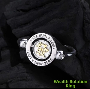 Macro shot of rotating silver ring with golden 'Fa' character and New Year engraving