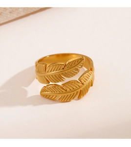 Detailed view of the golden leaf texture on this adjustable stainless steel ring band