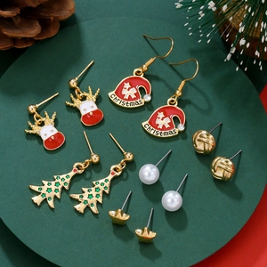 Detailed flat lay of 6-pair Christmas stud earring set with reindeer and snowflake motifs