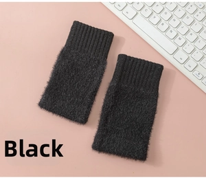 Detail of black plush fingerless gloves with ribbed cuffs and soft thermal texture