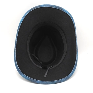 Detail of western cowboy hat interior showing black lining and adjustable drawstring
