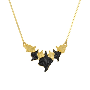 Irregular leaf necklace with black and gold bat pendant design on a silver chain