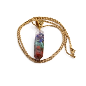 Seven chakra resin column pendant necklace with a golden twist chain and colorful stones