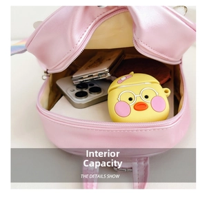 Detail shot showing the spacious inner compartment of the pink quilted kid backpack