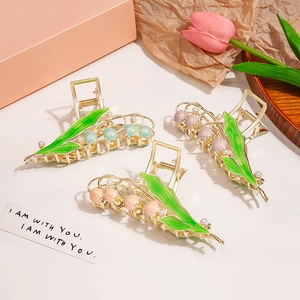 Elegant floral metal hair claws with lily of the valley design and pearl accents