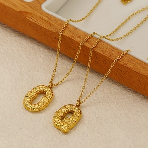 18k gold plated stainless steel necklaces with textured O-shaped letter pendants