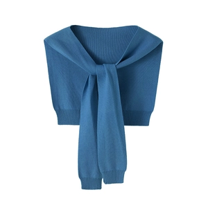 Close-up of deep blue core-spun yarn knit shawl with soft texture and flat lay design