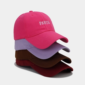 British style PARIS embroidered baseball caps in multiple colors on minimalist background