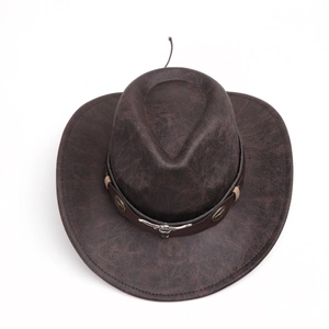 Close-up of vintage brown suede cowboy hat with silver bull head and star metal ornaments