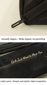 Detail of smooth wide zipper and golden text print on black mesh cosmetic bag