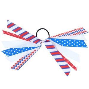 Detailed shot of red, white, and blue ribbons with stars and stripes on hair scrunchie