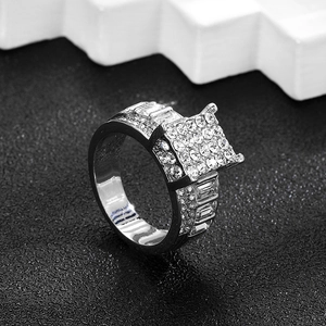 Detail view of silver iced out Cuban ring with micro-paved cubic zirconia stones