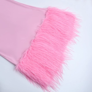 Detailed close-up of pink plain fabric with thick faux fur trim on a party dress