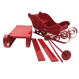 Detailed 6-piece red Christmas sleigh model kit with runners and base on white background