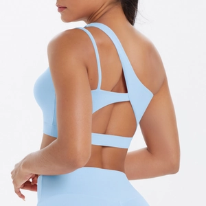 Detailed back view of light blue sports bra with asymmetrical strap and hollow out design
