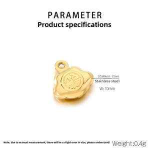 Macro detail of 10mm golden stainless steel Fu charm with auspicious cloud pattern