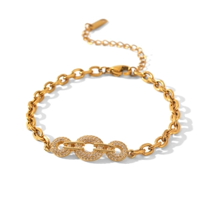 Close-up of gold chain bracelet with three interlocking diamond-paved rings
