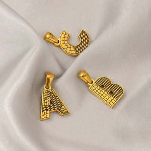 Polished gold plated titanium steel necklaces with textured uppercase A B C pendants