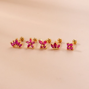 Golden crown and flower stud earring set with pink zircon on a soft pink background