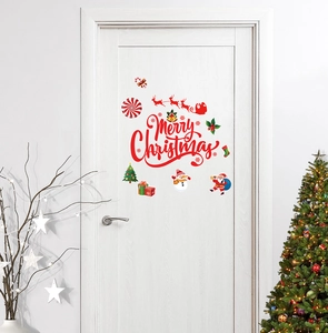 Detailed view of red Merry Christmas wall decals with Santa and snowman on white door