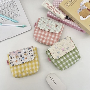 Three-piece checkered quilted mini storage pouches for cosmetics and travel essentials