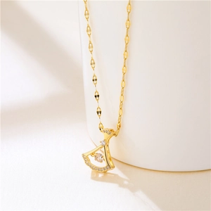 Elegant gold fan pendant necklace with sparkling zircons on a delicate lip link chain