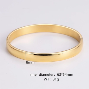 Close-up of 8mm gold minimalist bangle with 63x54mm dimensions and high-polish finish
