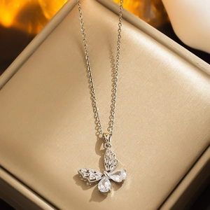 Elegant silver butterfly pendant necklace with cubic zirconia in a jewelry box