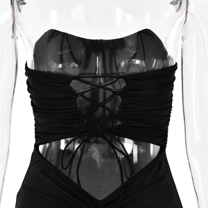 Close-up of black strapless dress back detail with lace-up cutout and ruched fabric