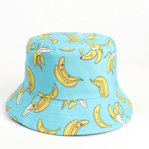 Detail of light blue bucket hat featuring vibrant yellow banana patterns and stitching
