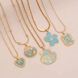 Blue ocean-themed gold necklaces with shell heart and hummingbird pendants set of five