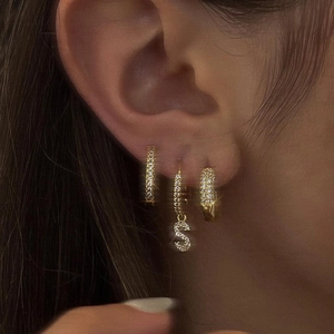 Gold plated hoop earrings set with zircon micro-paving and letter S pendant detail