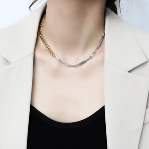 Women's creative two-tone Cuban chain necklace with gold and silver links on a model