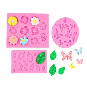 Pink silicone fondant mold set featuring flower leaf and butterfly shapes for cake decor