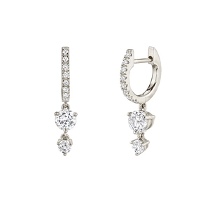 Detailed view of silver hoop earrings with double round sparkling cubic zirconia charms