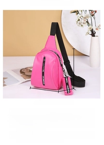 Detail of rose red PU chest bag with zipper pocket and detachable mini coin pouch