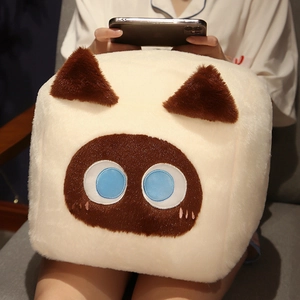 Detailed view of plush square Siamese cat pillow with embroidered blue eyes and soft fur