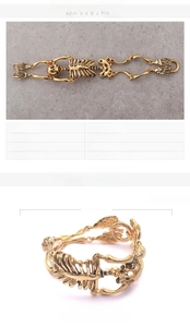 Macro detail of gothic skull skeleton link bracelet in gold-plated stainless steel