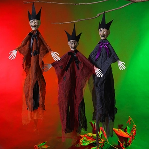Three hanging Halloween ghosts with skull masks and tattered robes in spooky party lighting