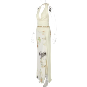 Detail of floral print on a high-slit maxi skirt with backless halter neck top set