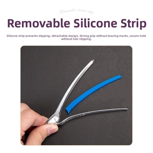 Detail of transparent hair clip featuring a removable blue silicone strip for no-trace grip