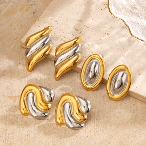 Three pairs of two-tone stainless steel oval shell earrings with gold and silver finishes